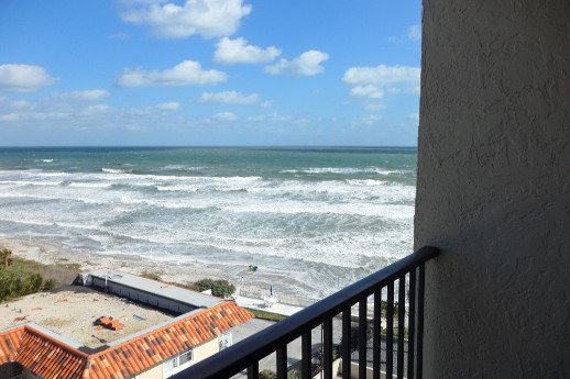 A balcony overlooking the beach