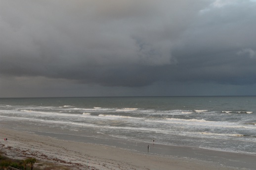 A beach beneath a cloudy sky.