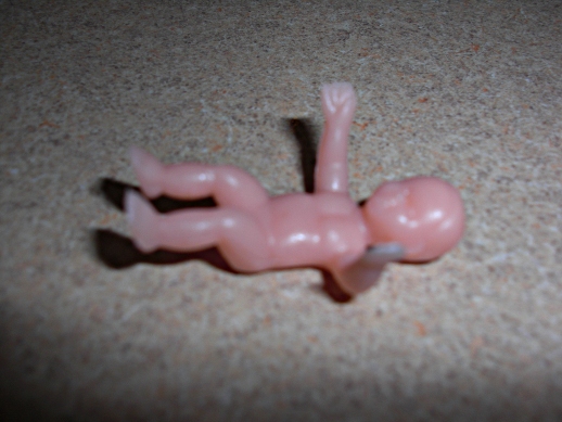 A plastic toy baby.